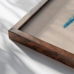 Black Man and Blue Horizon Jules Schmalzigaug close up dark wood mockup