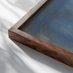 Blue Lake under Black Rock 1931 Zolo Palugyay close up dark wood mockup