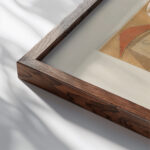 Collage 1937 Kurt Schwitters close up dark wood mockup