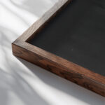 Collage with Three Elements 1922 Laszlo Moholy Nagy close up dark wood mockup