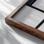 Composition with Blue Red Yellow and Black 1922 Piet Mondrian close up dark wood mockup