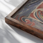 Decoratief ontwerp met twee handtekeningen 1874 Carel Adolph Lion Cachet close up dark wood mockup