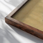 Dessin preparatoire pour un peigne orne de cygnes et de nenuphars 1900 Georges Callot close up dark wood mockup
