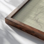 Drie ontwerpen voor een bord 1874 Carel Adolph Lion Cachet close up dark wood mockup