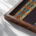 Four bands on black ground late 19th century Unknown close up dark wood mockup