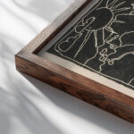 Kerstkaart met heuvellandschap en meer 1906 Reijer Stolk close up dark wood mockup
