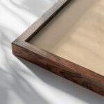 Miscellaneous small sketches for inlaid table tops.Design with red and pink circular motif 1930 Winold Reiss close up dark wood mockup