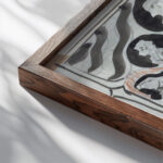 Ontwerp met staande vrouw met ruiters aan weerszijden 1874 Carel Adolph Lion Cachet close up dark wood mockup