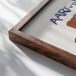 Ontwerp voor boekband van De Kleine Rudolf door Aart van der Leeuw 1891 Leo Gestel 1 close up dark wood mockup