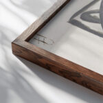 Ontwerp voor boekband van De Kleine Rudolf door Aart van der Leeuw 1891 Leo Gestel close up dark wood mockup