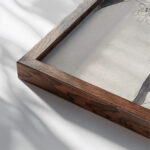 Plantstudie brandnetel 1874 Carel Adolph Lion Cachet close up dark wood mockup