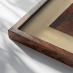 Still life with penny 1941 Kurt Schwitters close up dark wood mockup