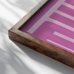 typographic 0013 giddyup pink 3x4 close up dark wood mockup