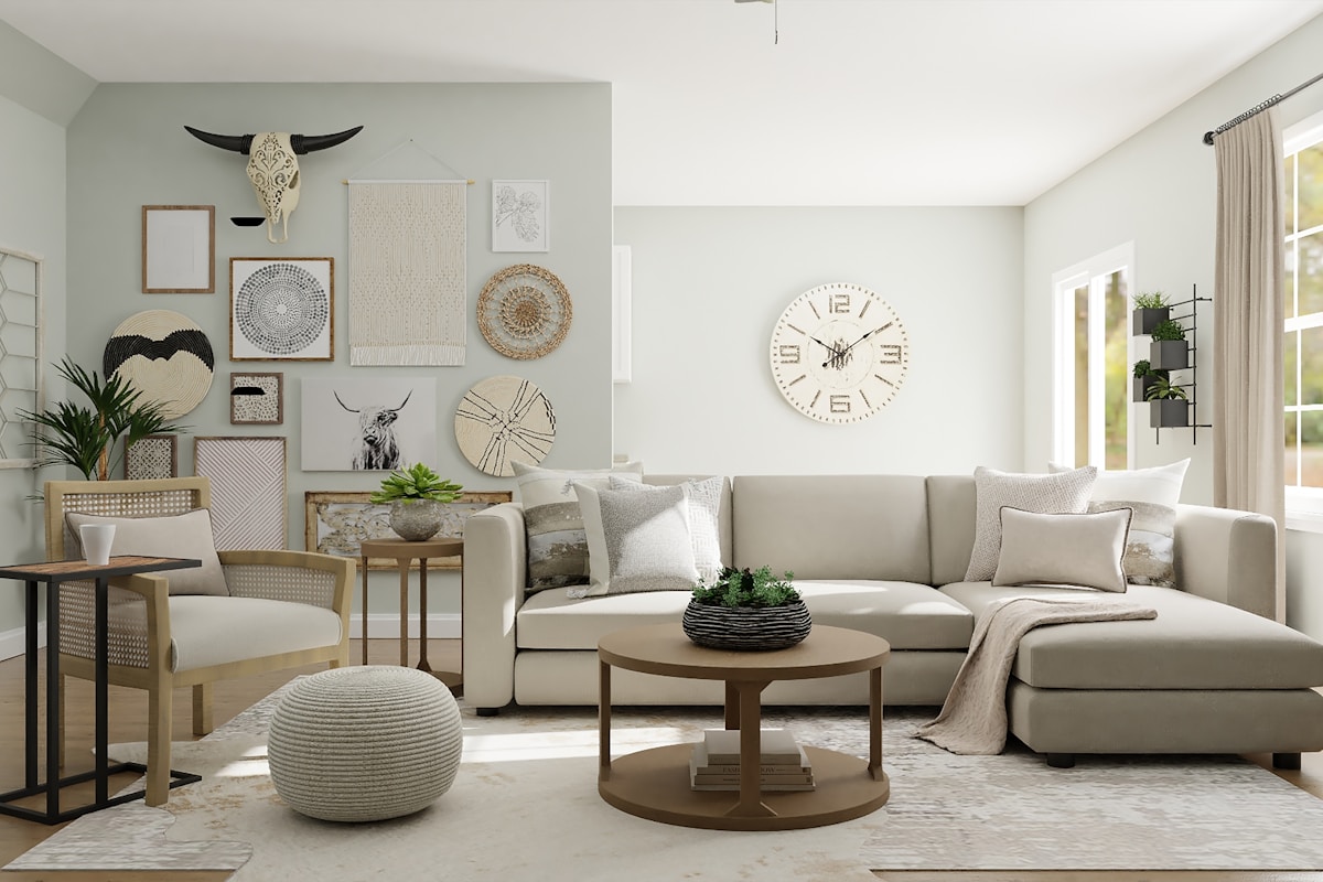 Boho living room with a mixed gallery wall of macramé hanging, woven baskets, a decorative cow-skull piece, and a large round wall clock above a cream sectional sofa.