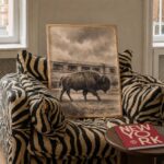 Bison Walking Past a Passing Train Print